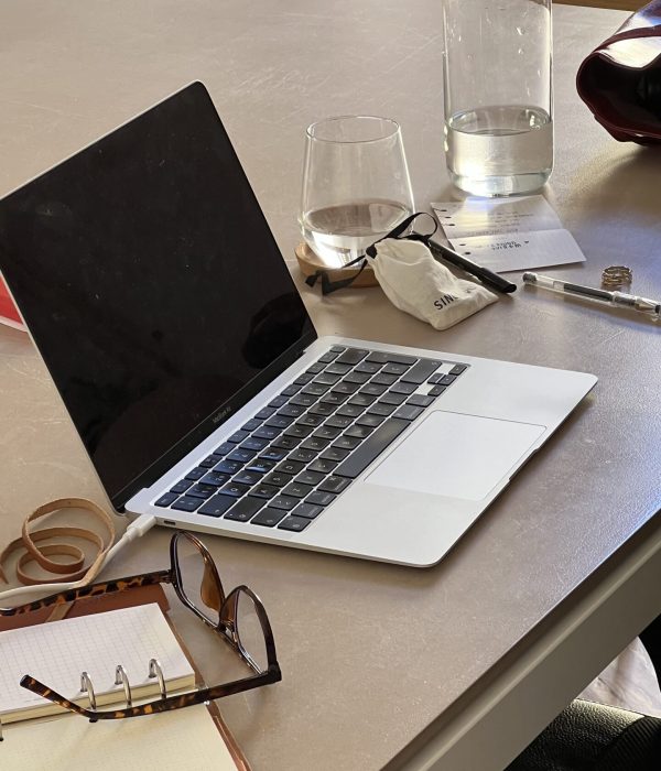 laptop meant to represent a data analyst dealing with a founder overwhelmed by data.